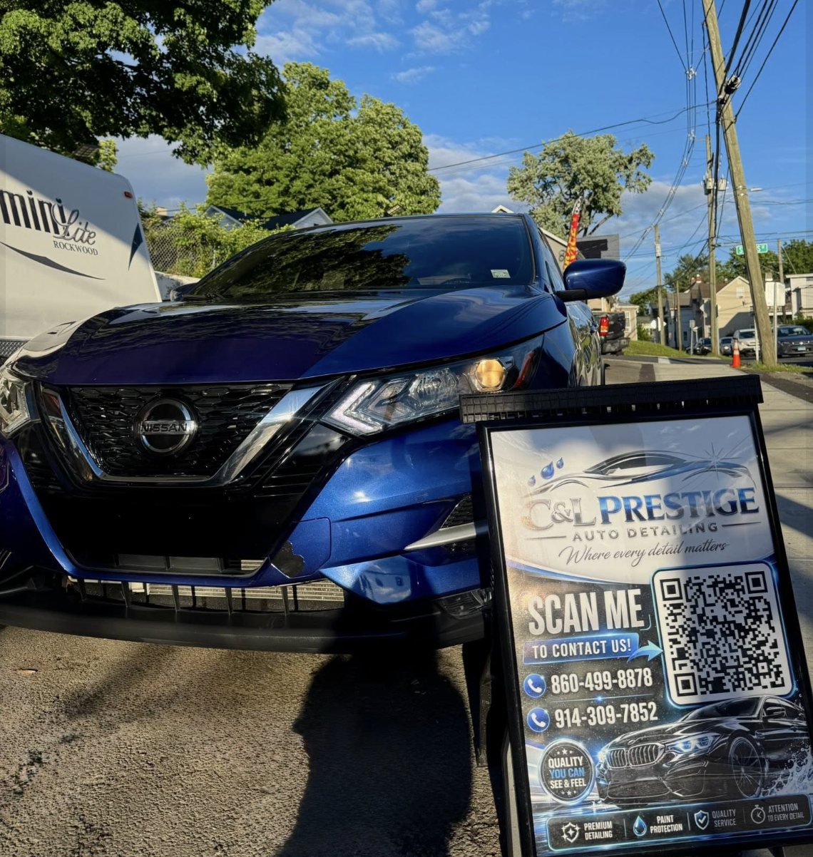 Freshly detailed SUV with the C&L Prestige sign board on site